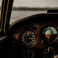 Vintage aircraft instrument panel showing stable readings with rain-streaked window. Luke warns of faith without roots.