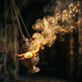 Fragrant smoke from a swinging censer transforms into golden musical notes against a dark background.