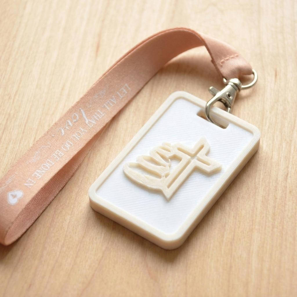 A 3D-printed Eben Tag in White and Beige featuring a raised Galed stacked stone design. This NFC-enabled touchpoint is designed to trigger the Daily Eb devotional.