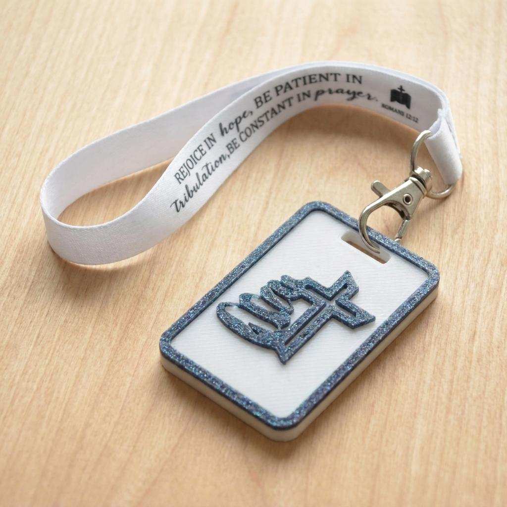 A 3D-printed Eben Tag in White and Metallic Blue featuring a raised Galed stacked stone design. This NFC-enabled touchpoint is designed to trigger the Daily Eb devotional.