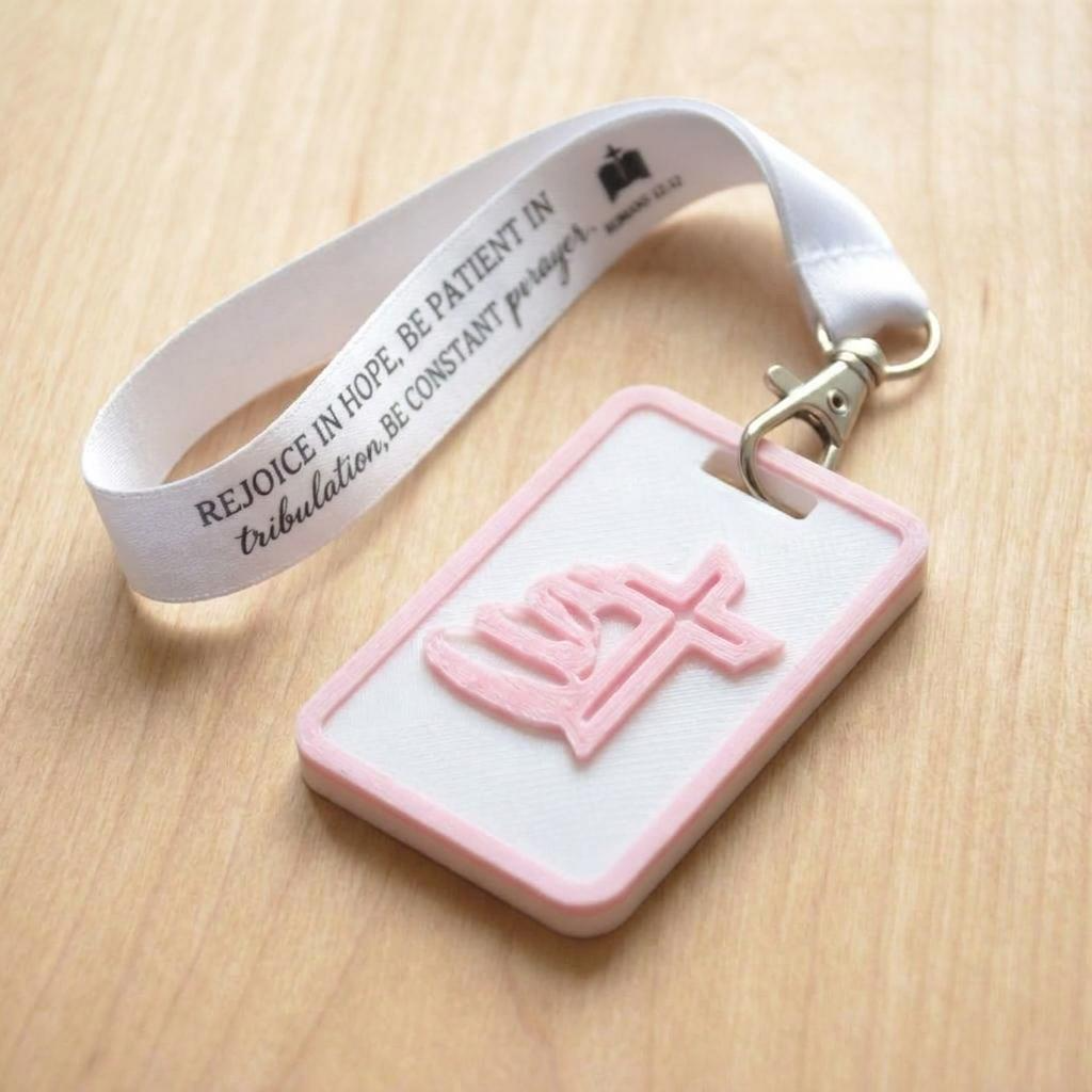 A 3D-printed Eben Tag in White and Pink featuring a raised Galed stacked stone design. This NFC-enabled touchpoint is designed to trigger the Daily Eb devotional.